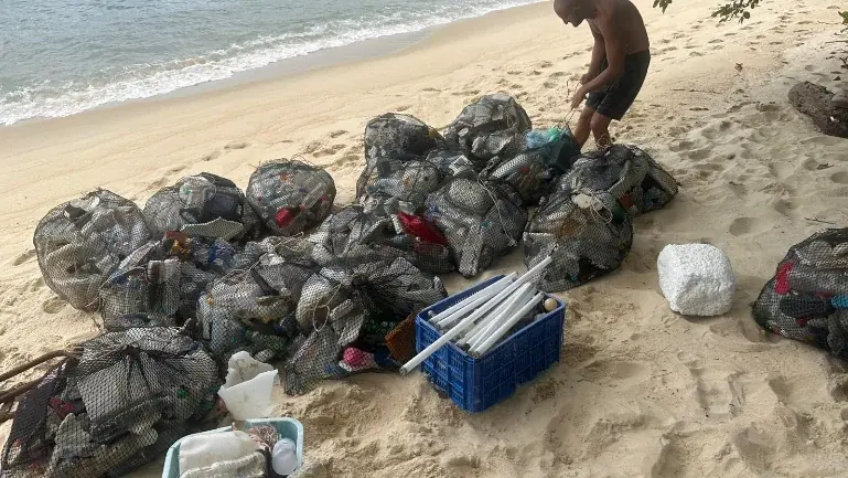 Save Koh Lipe clean-up crew working a beach on one of the surrounding islands